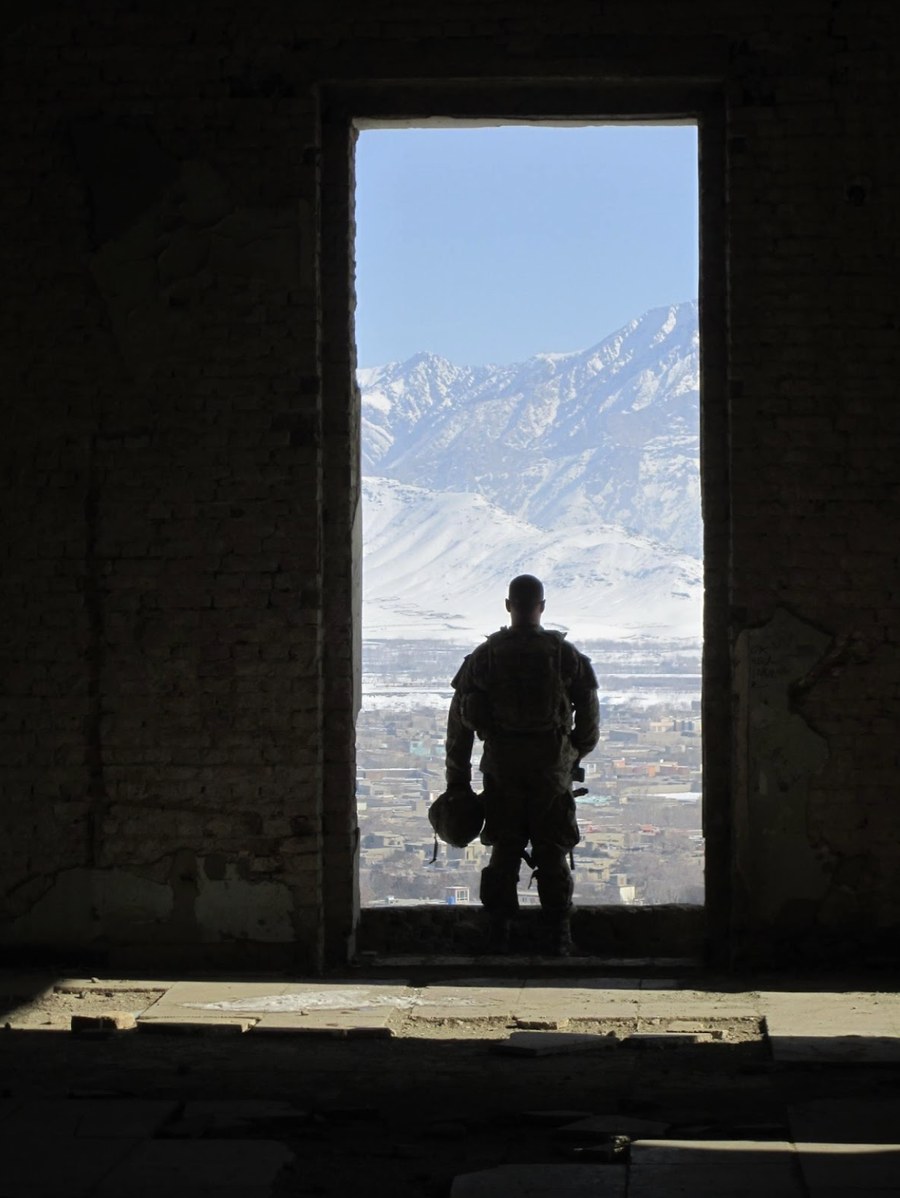 Scott Osborn during his combat deployment in Afghanistan, looking out across snow-capped mountains